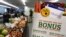 FILE - A sign advertises food stamp-related services at a farmer's market in Topsham, Maine, March 17, 2017.