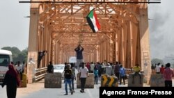 Sudanese people protest against a military coup overthrowing the transition to civilian rule on Oct. 25, 2021 in the capital Khartoum's twin city of Omdurman.