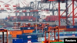 FILE - Shipping containers are seen at the Port Newark Container Terminal near New York City.