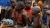 FILE - Orphans and children separated from their parents in Kadugli gather for food at an IDP Camp in Boram County, Nuba Mountains, South Kordofan, Sudan, June 22, 2024.