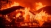 A home burns during the Eaton fire in the Altadena area of Los Angeles County, California on January 8, 2025. (Photo by JOSH EDELSON / AFP)