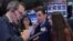 Specialist trader Peter Mazza works with his daughters at his booth on the floor at the New York Stock Exchange during a traditional bring-your-kids-to-work day in New York City, Nov. 23, 2018.
