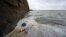Rubbish including discarded plastic bottles and food wrappers, is pictured floating on the water surface in the Marine Lake at West Kirby in northwest England on April 22, 2024. Earth Day, observed annually on April 22, was first celebrated in 1970.