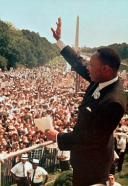 FILE - In this Aug. 28, 1963 file photo, the Rev. Dr. Martin Luther King, Jr. acknowledges the crowd at the Lincoln Memorial for his "I Have a Dream" speech during the March on Washington.