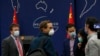 The New York Times Beijing based correspondent Steven Lee Myers, left, chats with other foreign journalists after a daily briefing at the Ministry of Foreign Affairs office in Beijing, March 18, 2020.