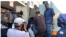 FILE - Zimbabwe police apprehend people they had found inside opposition Movement for Democratic Change Alliance offices in Harare following a raid there, Aug. 2, 2018. The people were arrested for leading protests that turned violent. (C. Mavhunga/VOA)