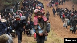 Migrants attempt to cross the Belarusian-Polish border at the Bruzgi-Kuznica Bialostocka border crossing, Belarus.