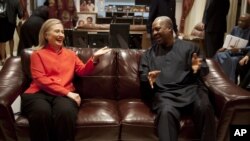 U.S. Secretary of State Hillary Rodham Clinton, left, meets with Ghana's President John Dramani Mahama, at his residence in Accra, Ghana, Aug. 9, 2012.