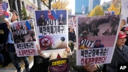 FILE - Demonstrators signifier    a rally against the caller    alleged deployment of North Korean troops to Russia, adjacent   the Seoul Central District Court successful  Seoul, South Korea, Nov. 15, 2024. The signs work   "Dismantling North Korea's atomic  weapons."