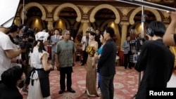 Zhu Jian, 69, acts on the set of a micro movie during a filming session at a banquet hall, in Zhengzhou, Henan province, China, July 16, 2024. 