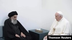 Pope Francis, right, meets with Iraq's leading Shiite cleric, Grand Ayatollah Ali al-Sistani in Najaf, Iraq, March 6, 2021.