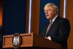 Britain's Prime Minister Boris Johnson gives an update on relaxing restrictions imposed on the country during the COVID-19 pandemic at a virtual press conference inside the Downing Street Briefing Room in London, July 5, 2021.