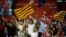Socialist supporters wave flags during a campaign rally in Barcelona on Apr, 25, 2019 ahead of the Apr. 28 general election.