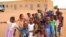 FILE - Children get ready to enter a class room in Yakouta, Burkina Faso. 