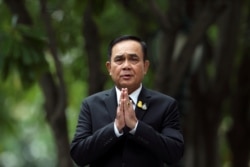 FILE - Thailand's Prime Minister Prayuth Chan-ocha gestures while speaking to media members at the Government House in Bangkok, June 6, 2019.