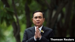 Thailand's Prime Minister Prayuth Chan-ocha gestures while speaking to media members at the Government House in Bangkok, June 6, 2019.