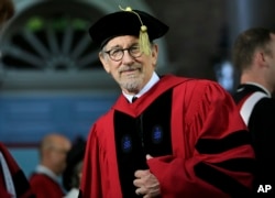 FILE - Filmmaker Steven Spielberg steps onto the stage during Harvard University commencement exercises, Thursday, May 26, 2016, in Cambridge, Mass. (AP Photo/Steven Senne)