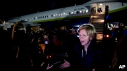 Democratic presidential candidate Sen. Elizabeth Warren, D-Mass., speaks to members of the media as she arrives at the Manchester-Boston Regional Airport in Manchester, N.H., Feb. 4, 2020, after traveling from Des Moines, Iowa following the Iowa caucus.