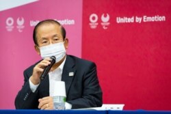 FILE - Tokyo 2020 Olympics chief Toshiro Muto speaks during the news conference in Tokyo, Japan, June 18, 2021.