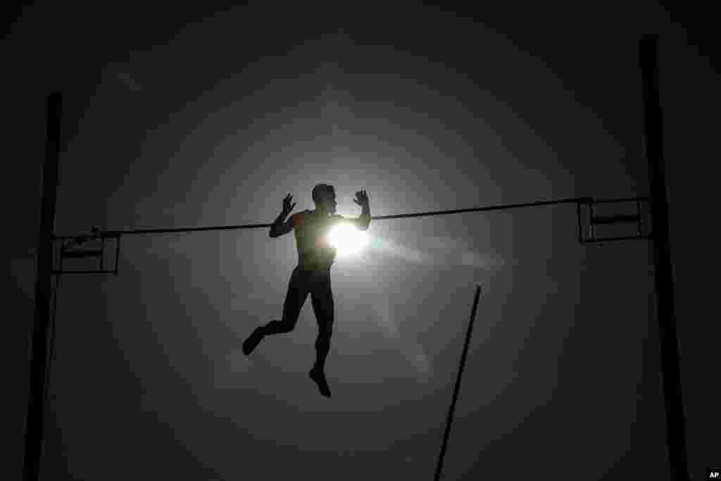 Athlete Dimitris Patsourakis from Greece competes at the Athens Street Pole Vault competition in front of Zappeion Hall, June 25, 2019.