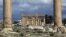 FILE - Temple of Baal Shamin seen through two Corinthian columns in the ancient oasis city of Palmyra, Syria.