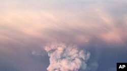 Smoke plumes from the Grimsvotn volcano, which lies under the Vatnajokull glacier, about 120 miles, (200 kilometers) east of Rejkjavik, May 23, 2011