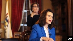Michigan Governor Gretchen Whitmer, who tells residents to stay at home, has criticized the federal response to the pandemic.
