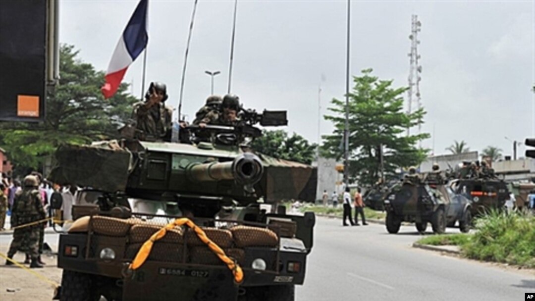 French soldiers from Operation Licorne in the Ivory Coast patrol in the 'Deux Plateaux' district of Abidjan, April 9, 2011