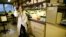 FILE - Dr Catherine Reynolds, a scientific researcher at Imperial College, poses for a picture at her laboratory in London, February 22, 2017. 