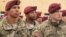 In this image taken from video, American military trainers are seen at the launch of joint U.S.-Ukrainian exercises in Yavoriv, Lviv region, western Ukraine, April 20, 2015. 