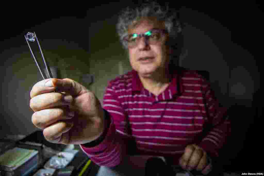 Sarkis Barsoumian, holding a gem, runs one of Bourj Hammoud's many jewelry workshops along with his brother Ohannes Barsoumian, Beirut, Lebanon, Feb. 26, 2016.