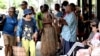 FILE - Traditional dancers perform to attract tourists at a shopping mall in downtown Suva, Fiji, on Dec. 15, 2022.