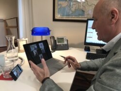 In this photo taken on March 27, 2020, Martin Weiss, ambassador of Austria to the U.S., is seen video conferencing in his office at the Embassy of Austria. (Courtesy of Austria Embassy)