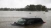 Sebuah mobil yang sebagian terendam terlihat ketika negara bagian New South Wales mengalami banjir, di Sydney, Australia, 22 Maret 2021. (Foto: REUTERS/Loren Elliott)