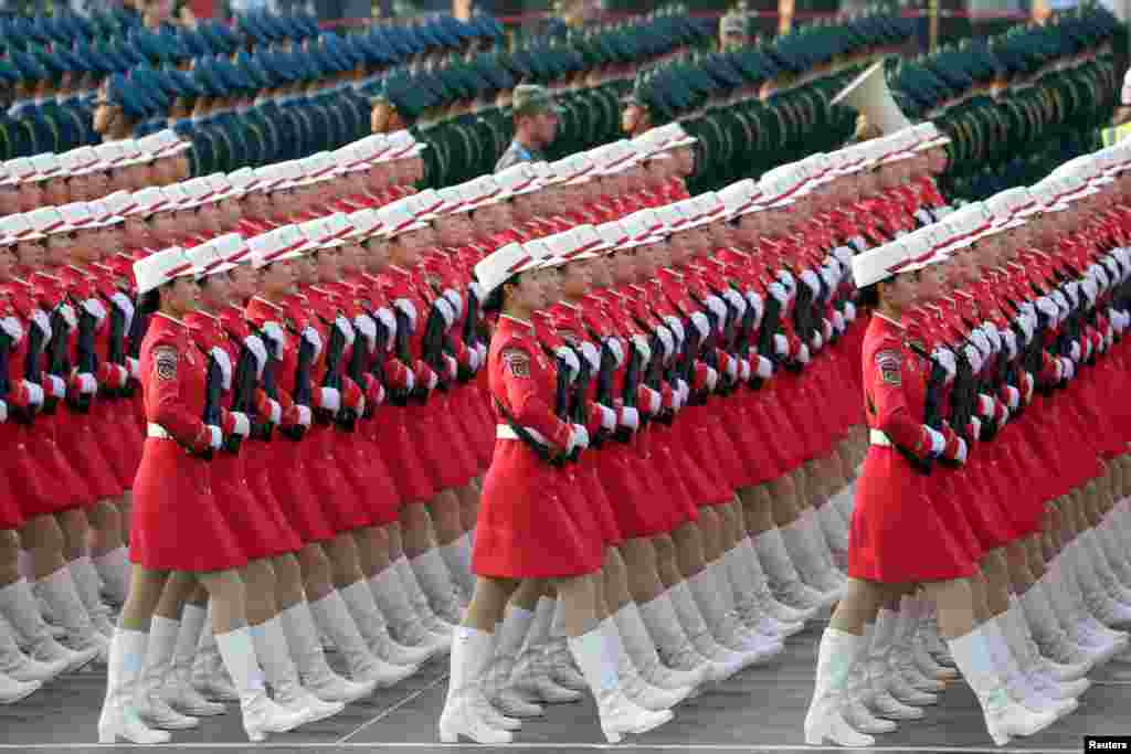 Militia members and soldiers of People&#39;s Liberation Army (PLA) march past Tiananmen Square during a rehearsal before a military parade marking the 70th founding anniversary of People&#39;s Republic of China, on its National Day in Beijing. 