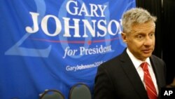 FILE - Libertarian presidential candidate Gary Johnson speaks to supporters and delegates at the National Libertarian Party Convention, in Orlando, Fla.