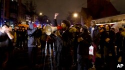 Protesters block an intersection in downtown Washington during a demonstration against perceived excessive use of force by police against minorities, Dec. 6, 2014.