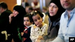 Syrian refugees attend the launch of an education program in Ankara, Turkey, June 8, 2017. 