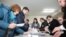 Members of a local electoral commission count votes following a parliamentary election in Chisinau, Moldova, Feb. 24, 2019. 