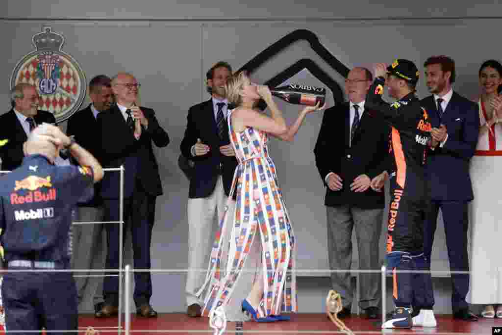 Princess Charlene of Monaco drinks champagne on the podium after Red Bull driver Daniel Ricciardo of Australia winning the Formula One race, at the Monaco racetrack, in Monaco, May 27, 2018.