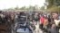 Restes d'un camion-citerne d'essence qui a pris feu après s'être renversé dans l'ouest du Kenya, à quelque 315 kilomètres au nord-ouest de Nairobi, sur l'autoroute très fréquentée entre Kisumu et la frontière avec l'Ouganda, le 18 juillet 2021. 