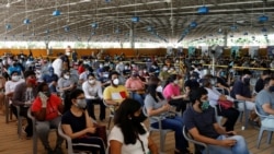 People waiting to receive a dose of Covishield at a vaccination center in New Delhi, on May 4, 2021.