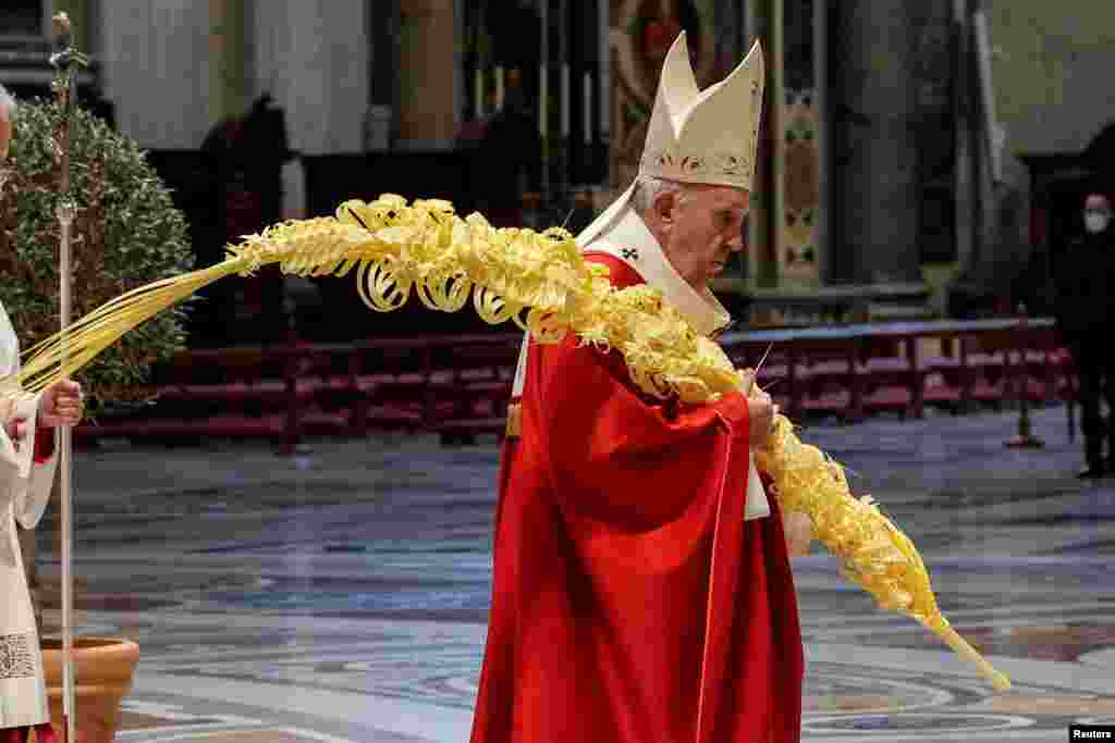 Pope Francis holds a Mass on Palm Sunday, amid COVID-19 restrictions in St. Peter&#39;s Basilica at the Vatican.