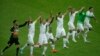 Members of the Algerian soccer team celebrate on the pitch after beating South Korea 4-2 on June 22, 2014.