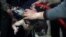 FILE - A child is treated in a hospital in Douma, eastern Ghouta, near Damascus, Syria, after an alleged chemical attack April 7, 2018. 