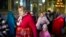 FILE - A woman leaves at the end of a religious service inside the Saint John the Baptist cathedral in Comrat, the capital of Gagauzia, an autonomous part of Moldova, Nov. 2, 2024.