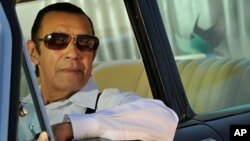 In this Oct. 2010 photo released by Montuno Productions America, Manuel Galban poses in a promotional photograph in Havana, Cuba