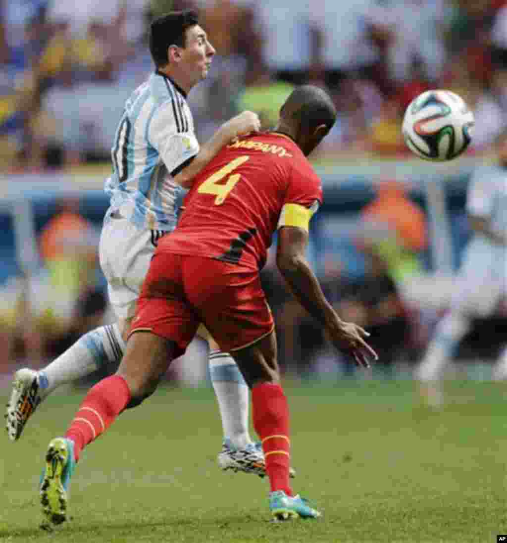 Argentina's Lionel Messi is fouled by Belgium's Vincent Kompany during the World Cup quarterfinal soccer match between Argentina and Belgium at the Estadio Nacional in Brasilia, Brazil, Saturday, July 5, 2014. (AP Photo/Eraldo Peres)