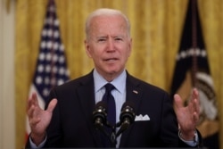 FILE - U.S. President Joe Biden delivers remarks on the April jobs report from the East Room of the White House in Washington, May 7, 2021.