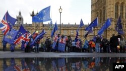 The hearse carrying Queen Elizabeth's coffin arrives at Buckingham Palace in London.